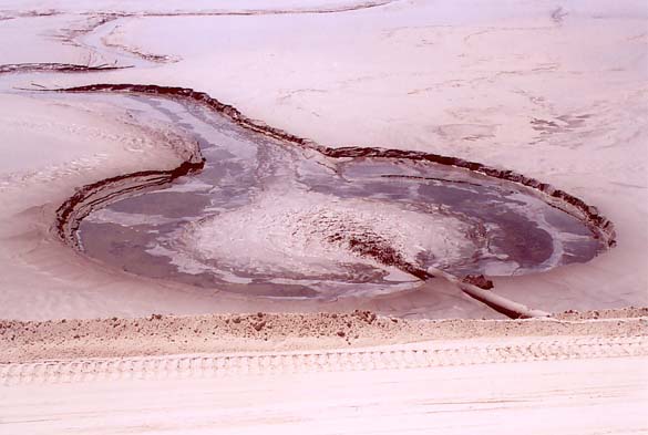 Filling with fine materials at upstream side of Spoil Dam at Quebrada Honda, Moquegua, Peru